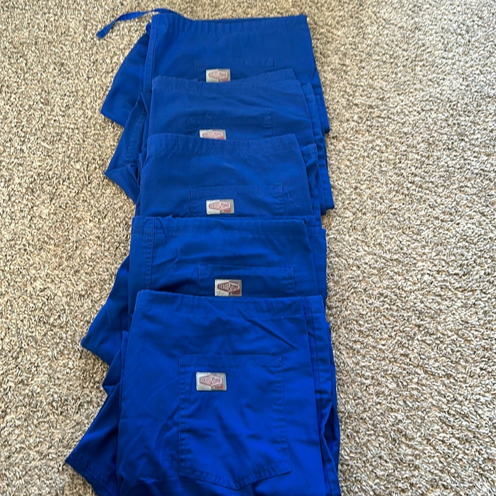 Set of 5 Scrub Zone blue scrub pants.
